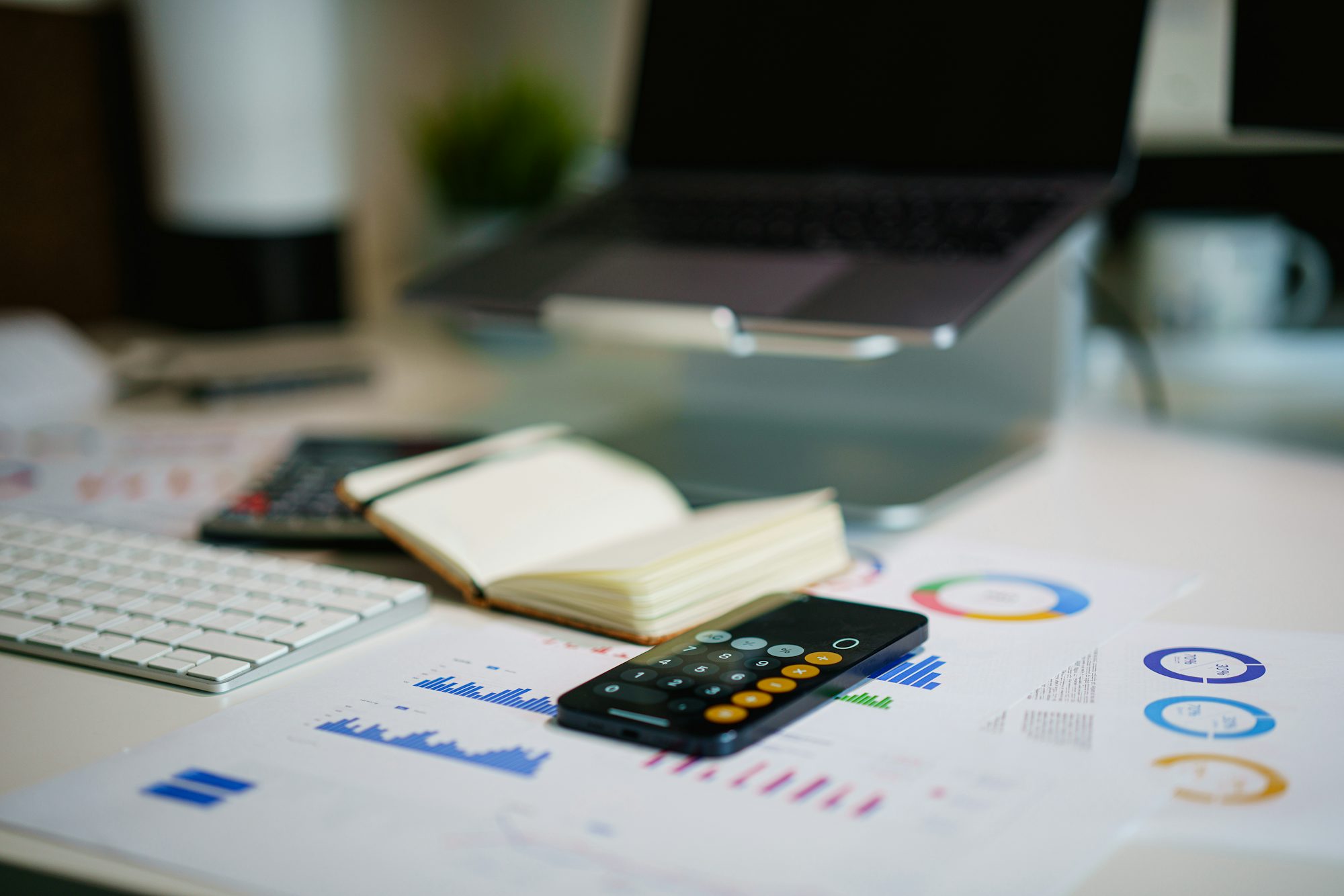 Desk with financial charts and calculator